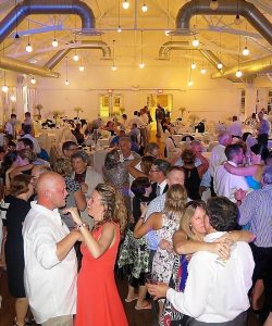 Wedding DJ services Syracuse packing a dance floor with a slow dance