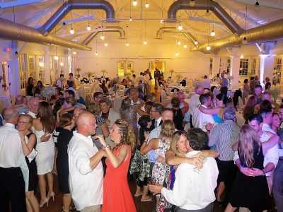 Wedding DJ services Syracuse packing a dance floor with a slow dance